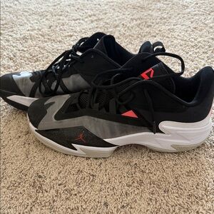 Nike Black and Gray Athletic Shoes with Red Accents